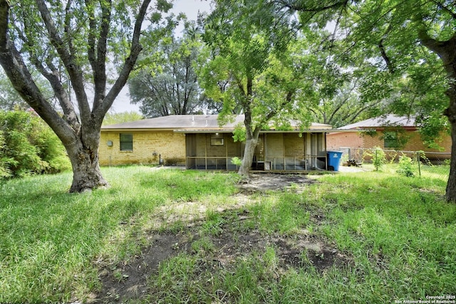 105 Apache, Cibolo, TX 78108 - back of property with brick siding and a sunroom