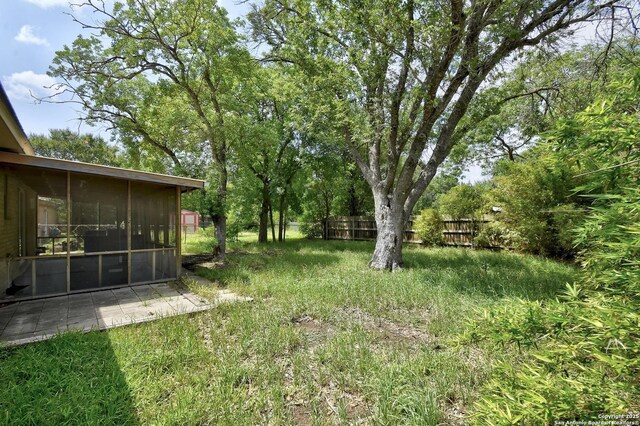 105 Apache, Cibolo, TX 78108 - view of yard featuring a sunroom and a patio