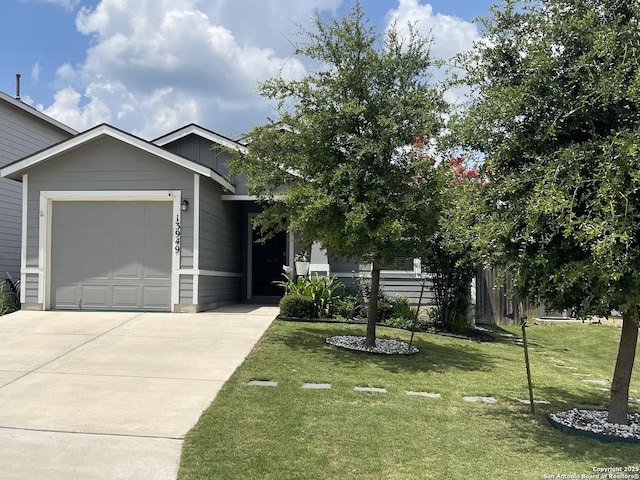 13949 Amazing Vly, San Antonio, TX 78254 - view of front of home featuring concrete driveway, a front yard, and a garage