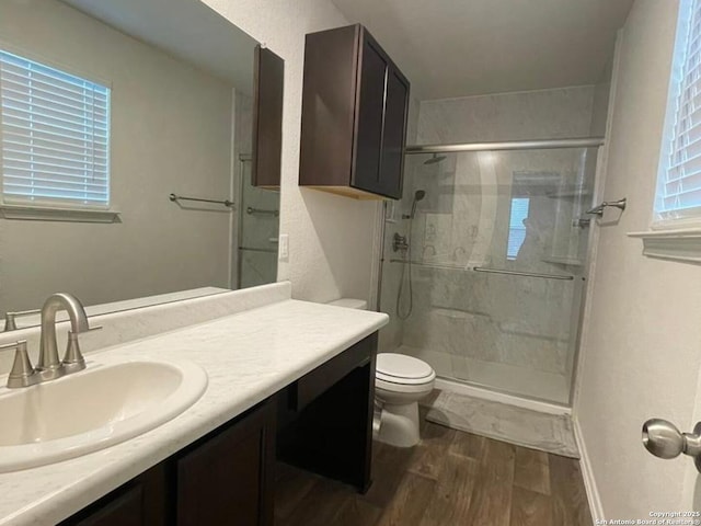 13949 Amazing Vly, San Antonio, TX 78254 - full bathroom featuring wood finished floors, a shower stall, and vanity