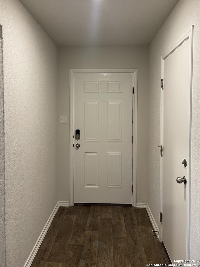 13949 Amazing Vly, San Antonio, TX 78254 - doorway featuring dark wood-type flooring and baseboards
