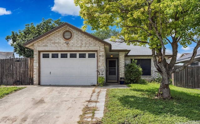 7643 Heathridge, San Antonio, TX 78250 - single story home with concrete driveway, a garage, roof with shingles, and brick siding