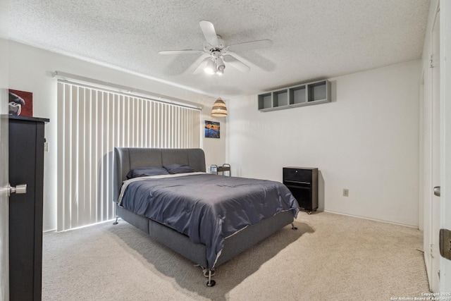 7643 Heathridge, San Antonio, TX 78250 - carpeted bedroom featuring a textured ceiling and ceiling fan