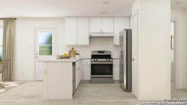13635 Aston Mnr, San Antonio, TX 78253 - kitchen featuring extractor fan, appliances with stainless steel finishes, light wood-type flooring, white cabinets, and light countertops
