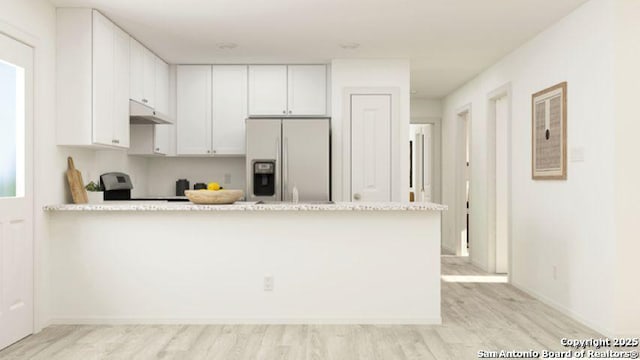13635 Aston Mnr, San Antonio, TX 78253 - kitchen with fridge with ice dispenser, a peninsula, light wood finished floors, white cabinets, and under cabinet range hood