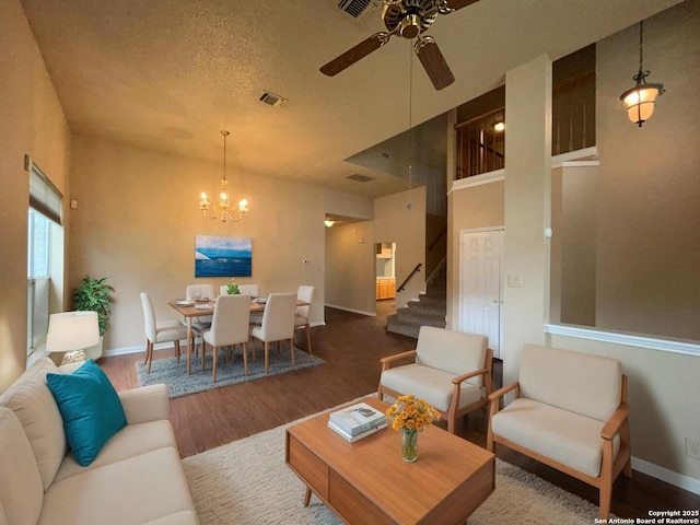 5103 Cabin Lake Dr, San Antonio, TX 78244 - living room featuring wood finished floors, ceiling fan, stairway, and a chandelier