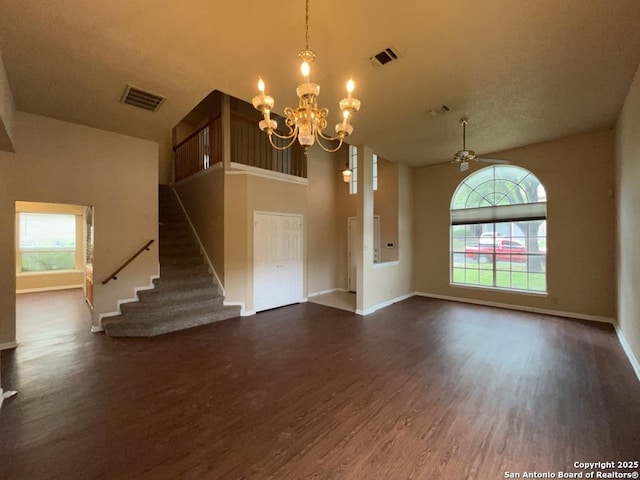 5103 Cabin Lake Dr, San Antonio, TX 78244 - unfurnished living room featuring dark wood-type flooring, a chandelier, stairs, and vaulted ceiling