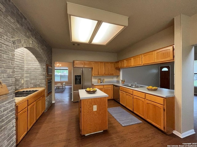 5103 Cabin Lake Dr, San Antonio, TX 78244 - kitchen with stainless steel appliances, a center island, dark wood-type flooring, and light countertops