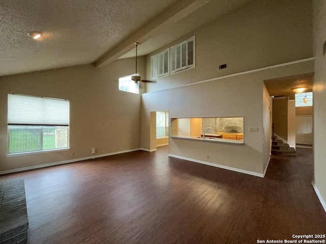 5103 Cabin Lake Dr, San Antonio, TX 78244 - unfurnished living room with dark wood-style floors, plenty of natural light, a textured ceiling, and stairway