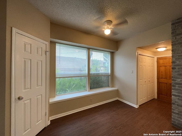 5103 Cabin Lake Dr, San Antonio, TX 78244 - unfurnished room with dark wood-style flooring, a textured ceiling, and a ceiling fan