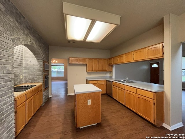 5103 Cabin Lake Dr, San Antonio, TX 78244 - kitchen with black appliances, a center island, dark wood-style flooring, and light countertops