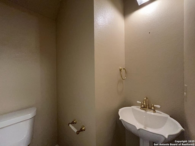 5103 Cabin Lake Dr, San Antonio, TX 78244 - bathroom featuring toilet and a sink