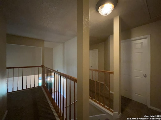 5103 Cabin Lake Dr, San Antonio, TX 78244 - hall featuring a textured ceiling and an upstairs landing