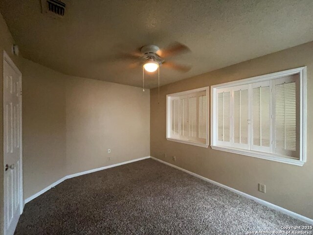 5103 Cabin Lake Dr, San Antonio, TX 78244 - spare room with ceiling fan and dark colored carpet
