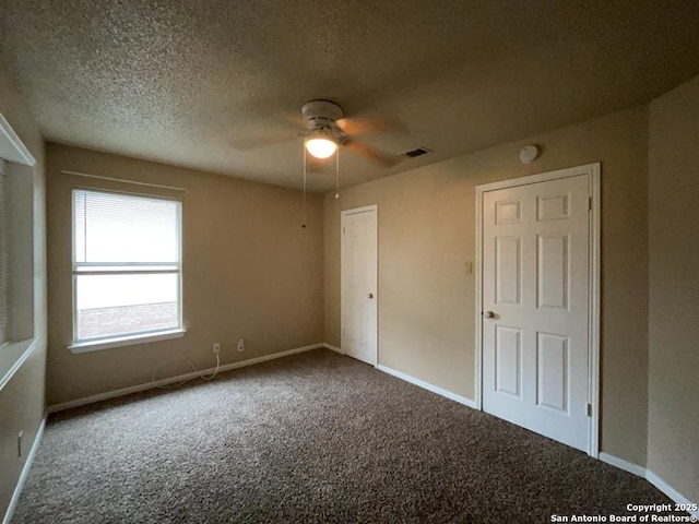 5103 Cabin Lake Dr, San Antonio, TX 78244 - unfurnished bedroom featuring carpet floors, a textured ceiling, and ceiling fan