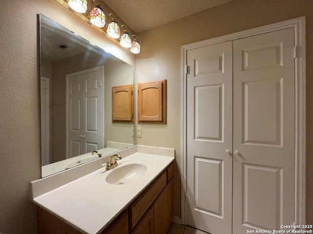 5103 Cabin Lake Dr, San Antonio, TX 78244 - bathroom with vanity and a textured ceiling