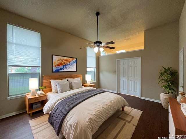 5103 Cabin Lake Dr, San Antonio, TX 78244 - bedroom featuring multiple windows, a ceiling fan, a textured ceiling, and a closet