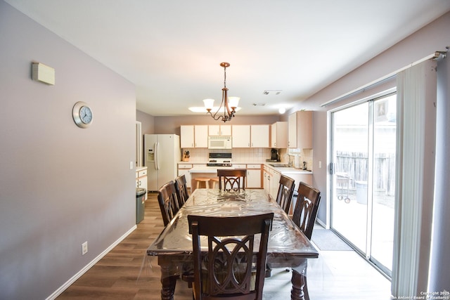 10310 Mission Crk, Converse, TX 78109 - dining room featuring wood finished floors and a chandelier