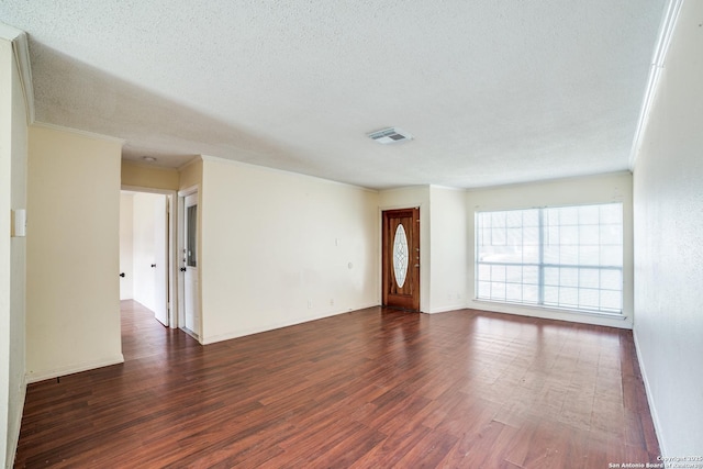 1034 Lemon Tree, San Antonio, TX 78245 - empty room featuring dark wood finished floors and a textured ceiling