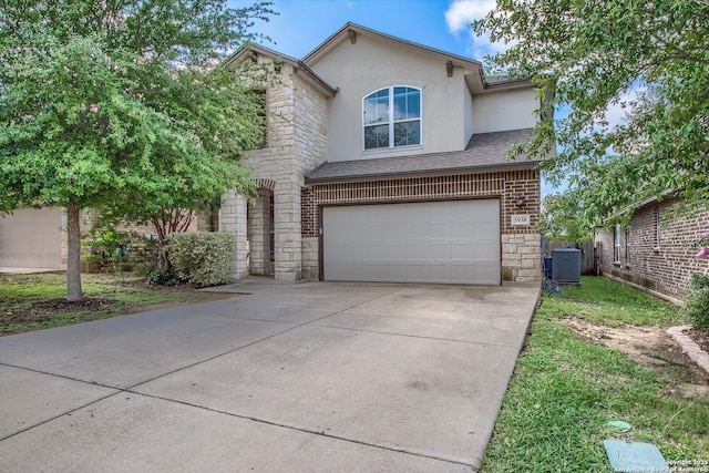 5938 Akin Song, San Antonio, TX 78261 - traditional-style house featuring an attached garage, driveway, stone siding, stucco siding, and brick siding