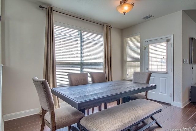 5938 Akin Song, San Antonio, TX 78261 - dining space with healthy amount of natural light and wood finished floors