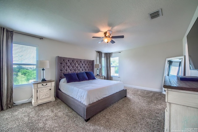 5938 Akin Song, San Antonio, TX 78261 - bedroom with light carpet, ceiling fan, and a textured ceiling