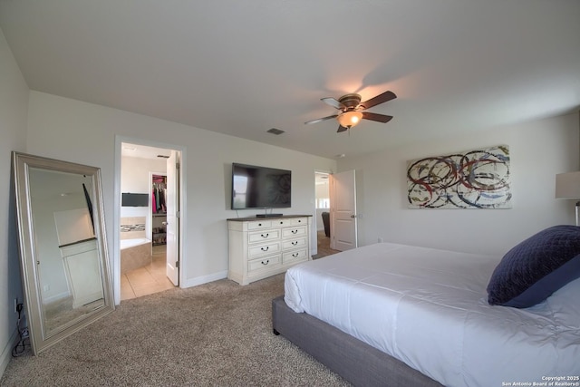 5938 Akin Song, San Antonio, TX 78261 - bedroom featuring light carpet, a ceiling fan, and ensuite bath