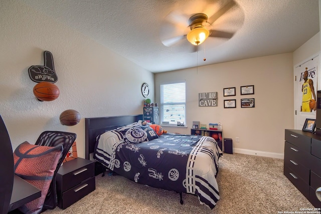 5938 Akin Song, San Antonio, TX 78261 - carpeted bedroom with a textured ceiling and a ceiling fan