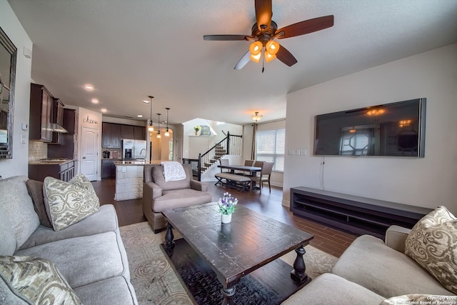 5938 Akin Song, San Antonio, TX 78261 - living area with stairway, a ceiling fan, wood finished floors, and recessed lighting