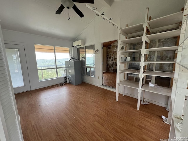 184 Guadalupe Hls, Seguin, TX 78155 - unfurnished room with a wall mounted AC, ceiling fan, wood finished floors, and lofted ceiling