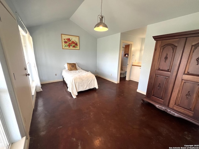 184 Guadalupe Hls, Seguin, TX 78155 - bedroom featuring concrete floors, vaulted ceiling, and ensuite bathroom