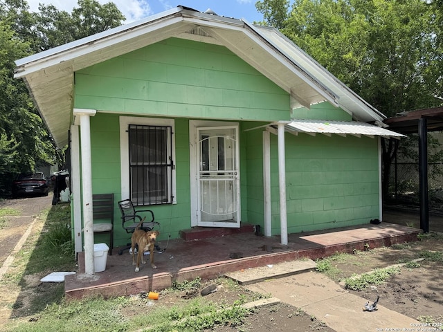 211 Wilcox, San Antonio, TX 78211 - view of front of home with covered porch and concrete block siding
