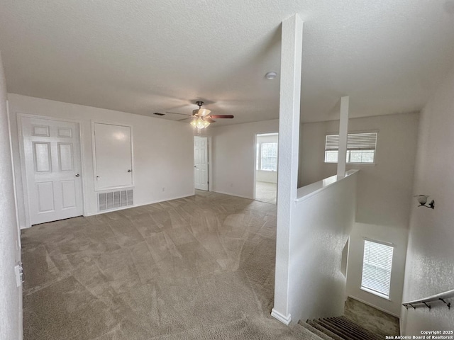130 Palazzo Torre, San Antonio, TX 78253 - spare room featuring a ceiling fan, light carpet, and a textured ceiling