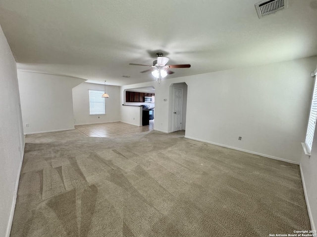 130 Palazzo Torre, San Antonio, TX 78253 - unfurnished living room with ceiling fan and light carpet