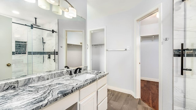 2530 Melrose Cyn, San Antonio, TX 78232 - full bathroom with a shower stall, a spacious closet, and vanity