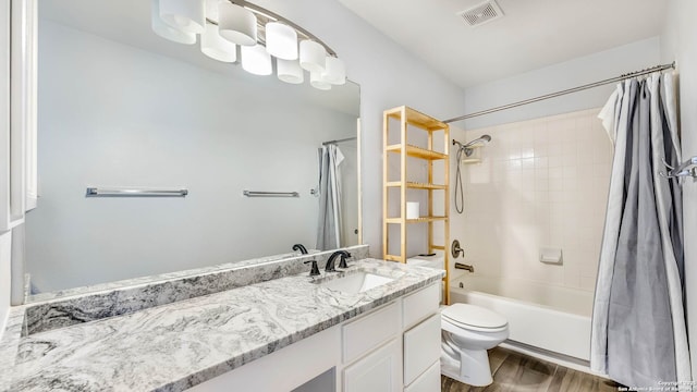 2530 Melrose Cyn, San Antonio, TX 78232 - bathroom with vanity, wood finished floors, and shower / bath combo
