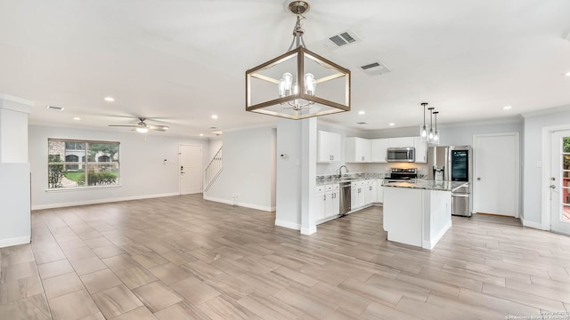 2530 Melrose Cyn, San Antonio, TX 78232 - kitchen featuring stainless steel appliances, recessed lighting, plenty of natural light, white cabinets, and open floor plan