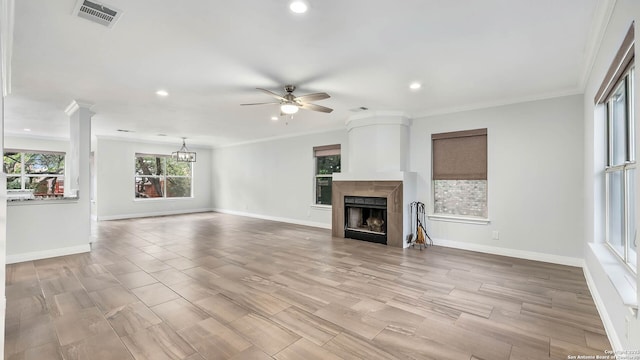 2530 Melrose Cyn, San Antonio, TX 78232 - unfurnished living room with a ceiling fan, recessed lighting, ornamental molding, a fireplace, and light wood finished floors