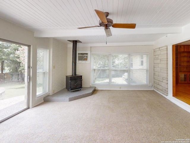 117 Bryker, Terrell Hills, TX 78209 - unfurnished living room featuring a wood stove, a wooden ceiling with exposed beams, carpet floors, and ceiling fan