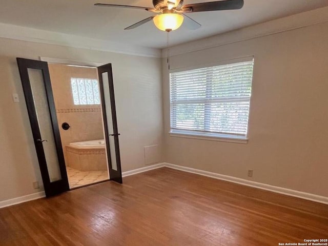 117 Bryker, Terrell Hills, TX 78209 - unfurnished bedroom featuring wood finished floors and a ceiling fan