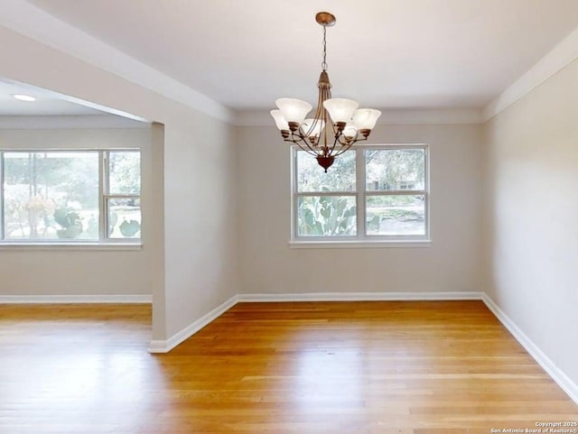 117 Bryker, Terrell Hills, TX 78209 - unfurnished room with a chandelier and light wood finished floors