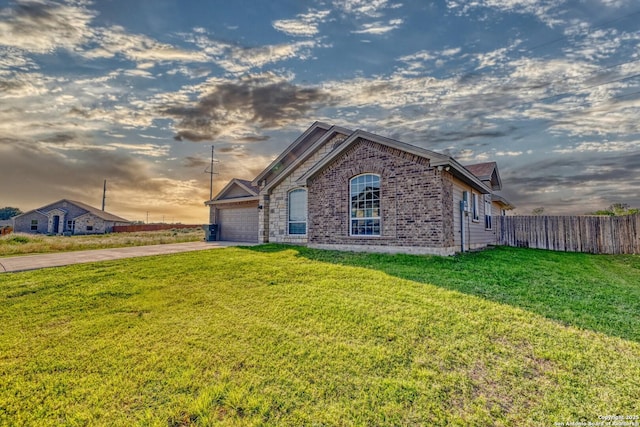 13 Hope, Uvalde, TX 78801 - view of front of home featuring concrete driveway, an attached garage, and brick siding