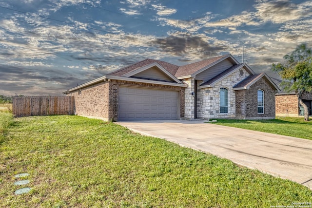 13 Hope, Uvalde, TX 78801 - view of front of property featuring driveway, an attached garage, and brick siding