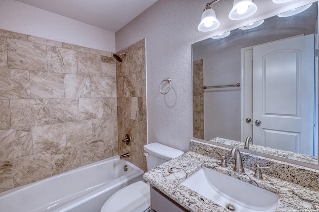 13 Hope, Uvalde, TX 78801 - full bathroom featuring a textured wall, tub / shower combination, and vanity