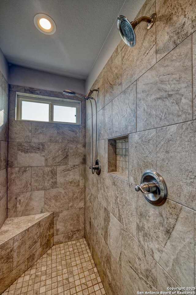 13 Hope, Uvalde, TX 78801 - full bath featuring tiled shower and a textured ceiling