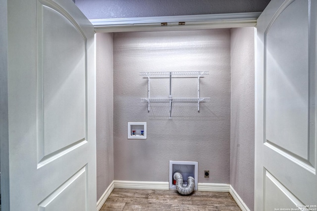 13 Hope, Uvalde, TX 78801 - washroom with wood finished floors, electric dryer hookup, and washer hookup