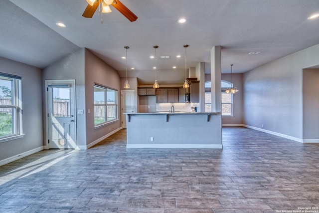 13 Hope, Uvalde, TX 78801 - kitchen featuring open floor plan, healthy amount of natural light, wood finished floors, and recessed lighting