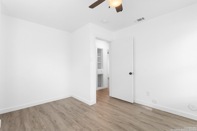 502 E Palfrey, San Antonio, TX 78223 - spare room featuring light wood-style flooring, a ceiling fan, and a smoke detector