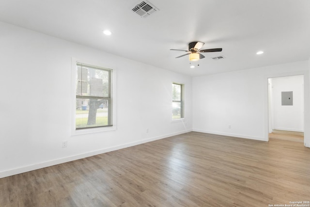 502 E Palfrey, San Antonio, TX 78223 - empty room with ceiling fan, electric panel, light wood-type flooring, and recessed lighting