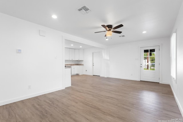 502 E Palfrey, San Antonio, TX 78223 - unfurnished living room featuring ceiling fan, recessed lighting, and light wood finished floors